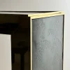 Console Materia con telaio in oro e piano in vetro fumé