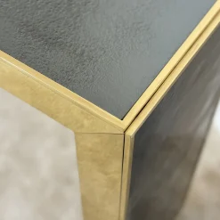 Console Materia con telaio in oro e piano in vetro fumé