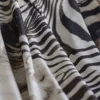 Coperta piccola con motivo a orlo scamosciato Zebra
