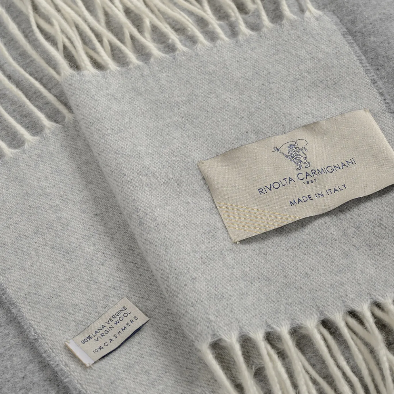 Coperta piccola grigia con frange Defilé