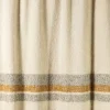 Coperta Solitudine a righe con frange in tonalità neutra