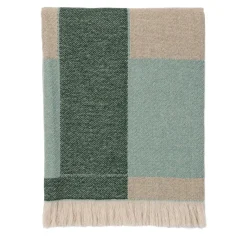 Coperta verde con frange e motivi intrecciati