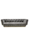 Divano Ivonne in velluto grigio con base in bronzo