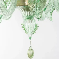 Lampadario Avior in vetro verde con dettagli dorati