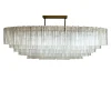 Lampadario ovale Tronchi con struttura in metallo brunito e vetro di Murano