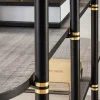 Libreria Boomerang in metallo nero e ottone con 4 ripiani di Pietro Russo Design