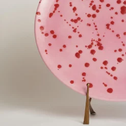 Piatto decorativo in ceramica fucsia e rossa