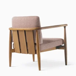 Poltrona Arne in legno di Iroko e tessuto rosso di Roberto Lazzeroni
