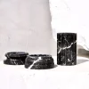 POR TAN TE Vaso a colonna in marmo nero satinato Marquina