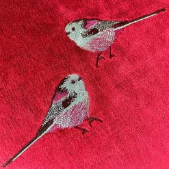 Puf tondo in velluto rosso e viola con ricamo