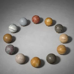 Scultura Fermacarte Gravity Zodiac Leone Sole in Travertino Arancione
