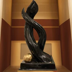 Scultura in ceramica sirena nera e oro