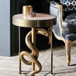Tavolino Cobra in metallo con finitura ottone satinato spazzolato