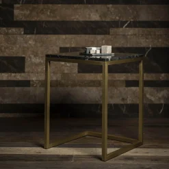 Tavolino Esopo in ottone e marmo nero di Antonio Saporito