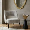 Tavolino Iconic a clessidra asimmetrica laccato oro e nero