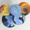 Tavolino rotondo Astraliti in metallo dai toni caldi #1