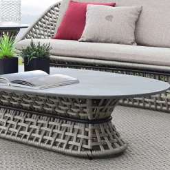 Tavolo da cocktail ovale grigio per esterni con piano in pietra