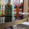Tavolo da pranzo ellittico Jerome con piano in vetro nero