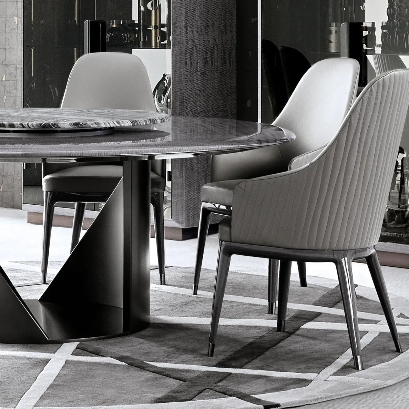 Tavolo da pranzo in pelle grigio trapuntato Mirage con braccioli