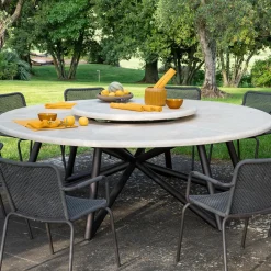 Tavolo da pranzo rotondo in pietra travertino e acciaio marrone per esterni Hermu 230