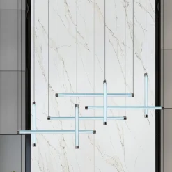 Trama S1 Una lampada a sospensione tubolare in vetro borosilicato acquamarina